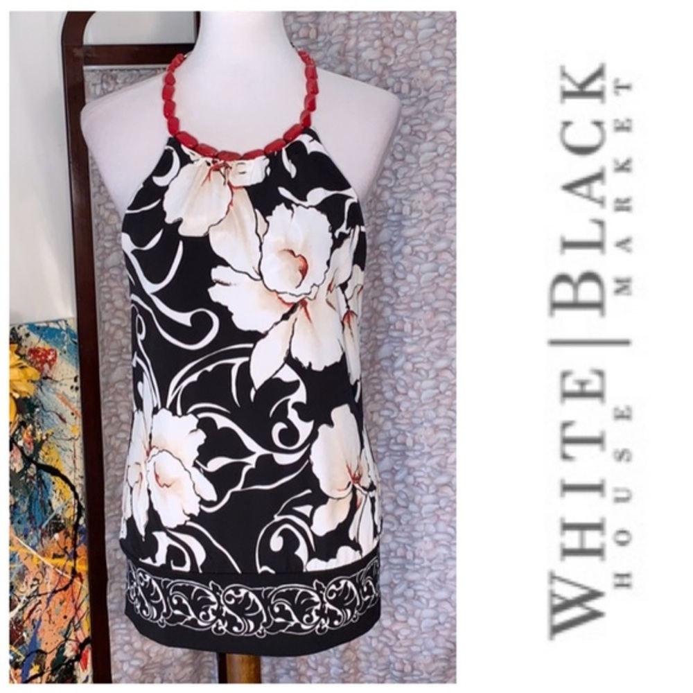 White House Black Market black with white orchids patterned halter top.